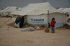 A Syrian refugee girl in Zaatari Camp, Jordan, where  new arrivals are still living in tents in the cold in harsh  desert conditions.